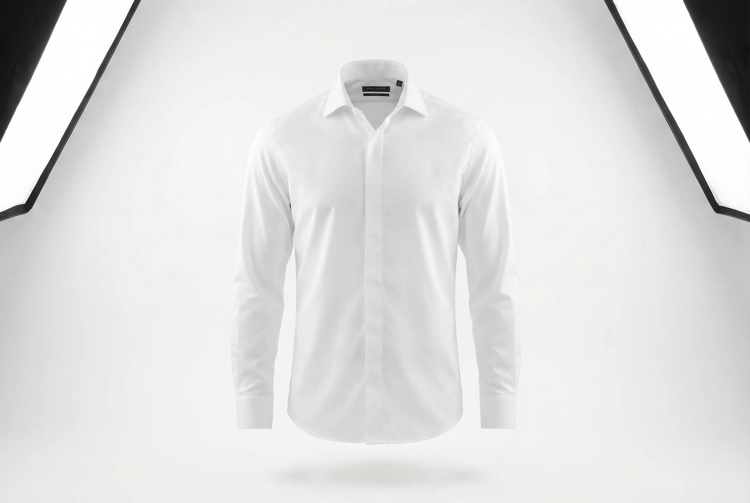 Ghost mannequin photography example showing a white dress shirt with the invisible mannequin effect on a clean white background